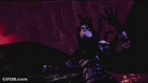 A Woman In A Black And White Striped Dress Is Standing In The Dark GIF
