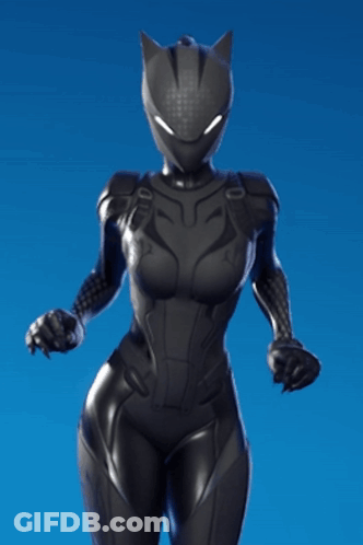 A Woman In A Black Cat Suit Stands In Front Of A Blue Sky GIF