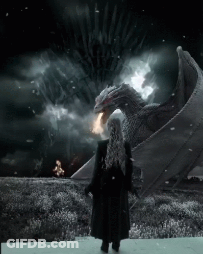 A Woman In A Black Coat Stands In Front Of A Large Dragon With A Throne In The Background GIF