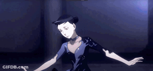 A Woman In A Black Dress Is Dancing In A Dark Room GIF