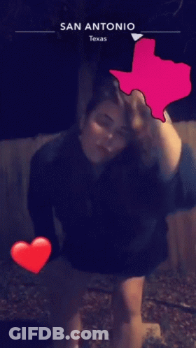 A Woman In A Black Dress Is Dancing In Front Of A Texas Map GIF