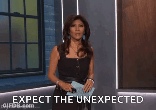 Woman In Black Dress Holding Clipboard Expect The Unexpected GIF