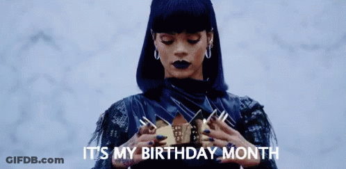 A Woman In A Black Dress Is Holding A Crown In Her Hands And Saying `` It 'S My Birthday Month '' . GIF