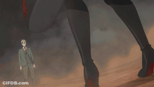 A Woman In A Black Dress Is Holding A Knife In Her Right Hand GIF