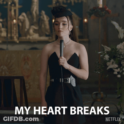 A Woman In A Black Dress Is Holding A Microphone And Says My Heart Breaks Netflix GIF