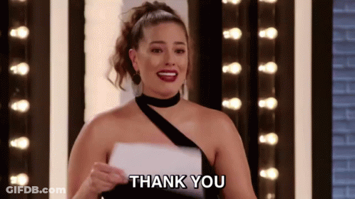 A Woman In A Black Dress Is Holding A Piece Of Paper And Says Thank You . GIF