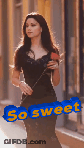 A Woman In A Black Dress Is Holding A Red Rose And The Word So Sweet Is Above Her GIF