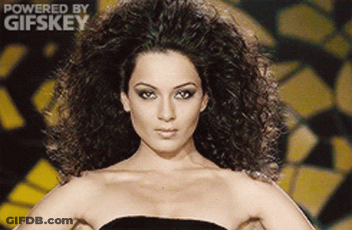 A Woman In A Black Dress Is Powered By Gifskey GIF