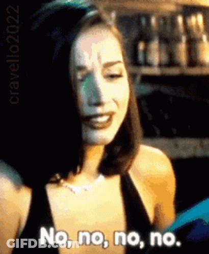 A Woman In A Black Dress Is Saying No No No No . GIF