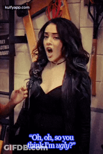 A Woman In A Black Dress Is Saying " Oh Oh So You Think I 'M Ugly " GIF
