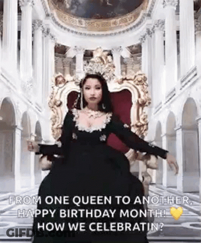 A Woman In A Black Dress Is Sitting On A Throne In A Room . GIF