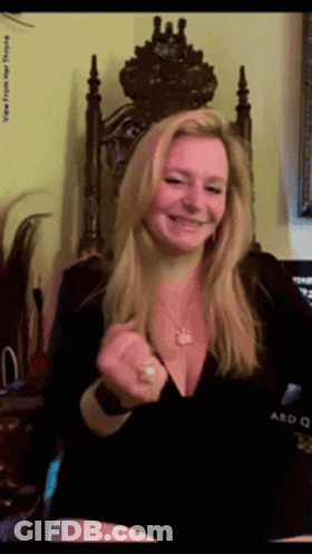 Woman In Black Dress Smiling With Crown GIF