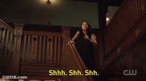 A Woman In A Black Dress Is Standing On A Set Of Stairs With The Words Sorority Initiation Thing Behind Her GIF