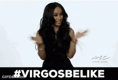 A Woman In A Black Dress Is Sticking Her Tongue Out While Dancing . GIF