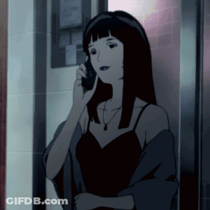 A Woman In A Black Dress Is Talking On A Cellphone GIF