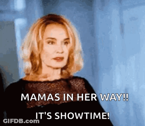 A Woman In A Black Dress Says Mamas In Her Way ! It 'S Showtime ! GIF