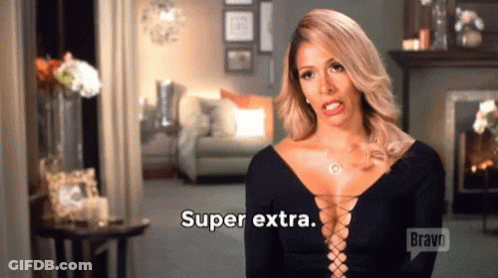 A Woman In A Black Dress Says Super Extra . GIF