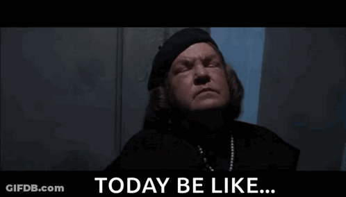 A Woman In A Black Hat Is Standing In Front Of A Wall And Says `` Today Be Like ... '' GIF