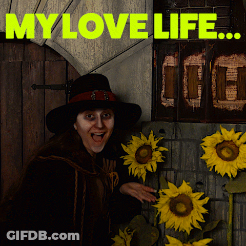 A Woman In A Black Hat Stands In Front Of Sunflowers And The Words " My Love Life " Above Her GIF