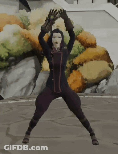 A Woman In A Black Jacket And Purple Pants Stands On Her Knees With Her Arms In The Air GIF
