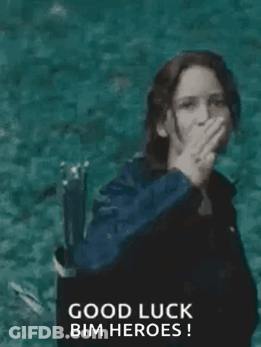 A Woman In A Black Jacket Is Giving The Middle Finger While Standing In The Water . GIF