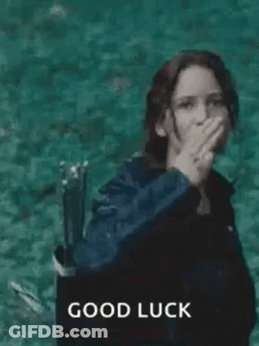 A Woman In A Black Jacket Is Giving The Middle Finger While Standing In The Water . GIF