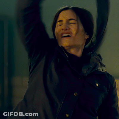 A Woman In A Black Jacket Is Making A Funny Face And The Caption Says Is It Hot GIF