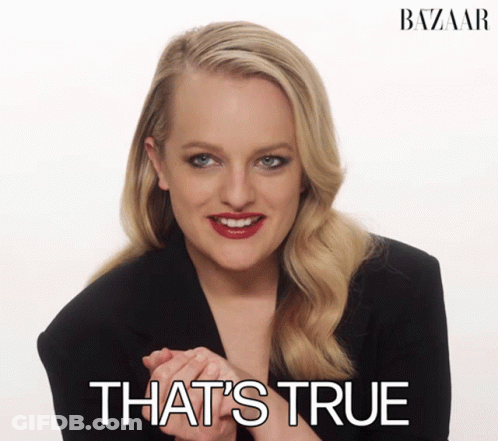 A Woman In A Black Jacket Smiles With The Words That 'S True Behind Her GIF