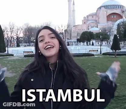 A Woman In A Black Jacket With The Word Istanbul On Her Jacket GIF