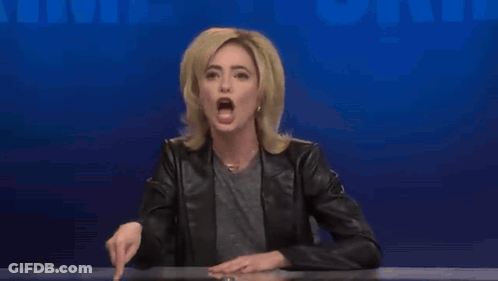 A Woman In A Black Leather Jacket Is Making A Funny Face GIF