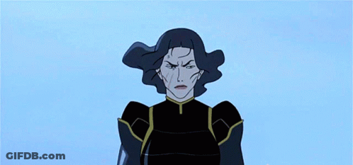A Woman In A Black Outfit Is Standing On Top Of A Building GIF