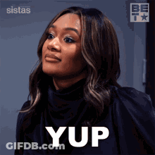 A Woman In A Black Shirt Is Saying Yup In White Letters GIF