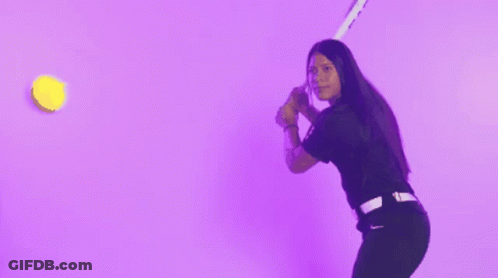A Woman In A Black Shirt Is Throwing Confetti In The Air Against A Purple Background GIF