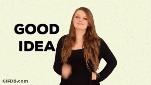 A Woman In A Black Shirt Says Good Idea In Sign Language GIF