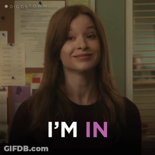 A Woman In A Black Shirt Says I 'M In In Pink Letters GIF