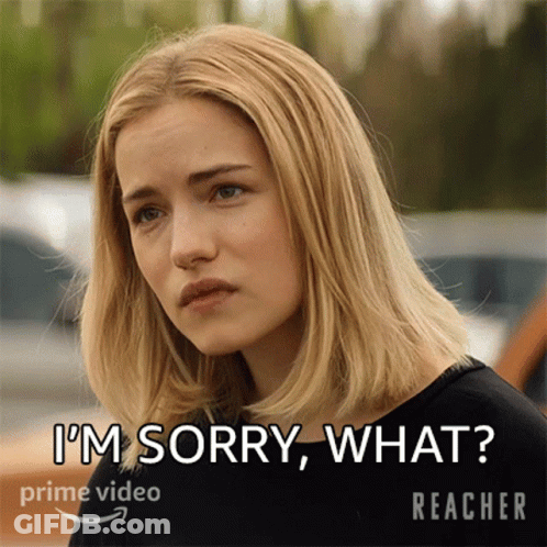 A Woman In A Black Shirt Says I 'M Sorry What In White Letters GIF