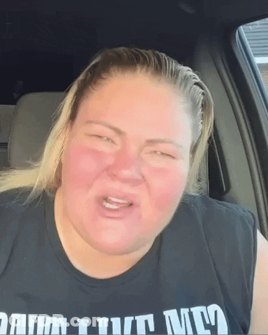 A Woman In A Black Shirt That Says I Turn Me GIF