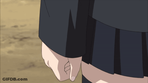 A Woman In A Black Skirt Holds Another Woman 'S Hand In A Close Up GIF