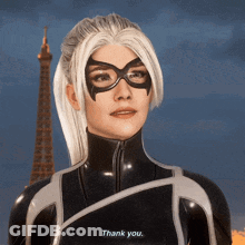 A Woman In A Black Suit And Mask Says Thank You GIF