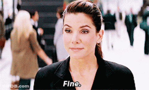 A Woman In A Black Suit Says Fine GIF