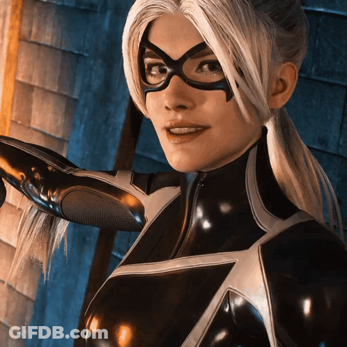 A Woman In A Black Superhero Costume With Glasses GIF