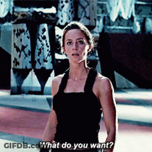 A Woman In A Black Tank Top Asks " What Do You Want " GIF