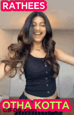 A Woman In A Black Tank Top Is Dancing With The Words Rathees Othakotta Written Above Her GIF