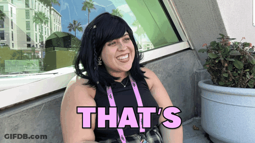 A Woman In A Black Tank Top Says That 'S GIF