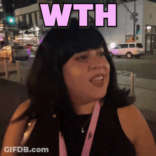 A Woman In A Black Tank Top With A Pink Lanyard Around Her Neck Says " Wth " GIF