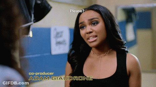 A Woman In A Black Tank Top With The Name Adam Giaudrone On The Bottom Right GIF