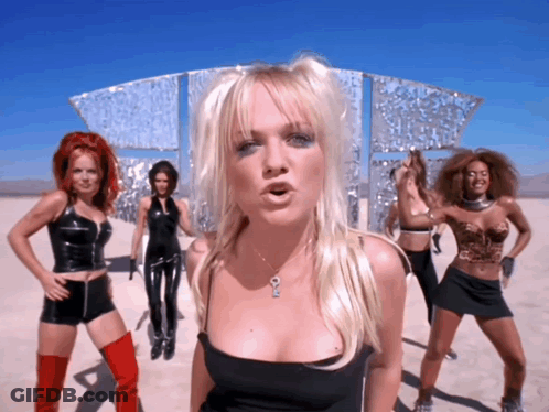 A Woman In A Black Top Has A Key Necklace GIF