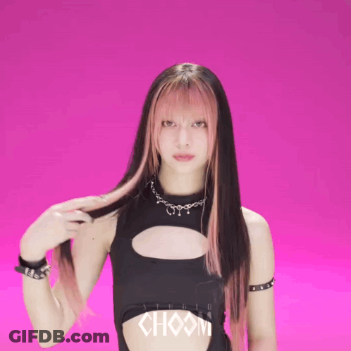 A Woman In A Black Top With Choom Written On It GIF