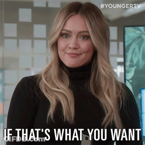 A Woman In A Black Turtleneck Is Smiling And Says " If That 'S What You Want " GIF