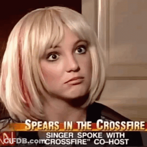 A Woman In A Blonde Wig Is Talking On A News Channel . GIF